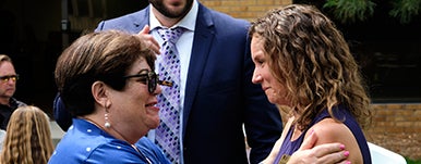 two people smiling at graduation