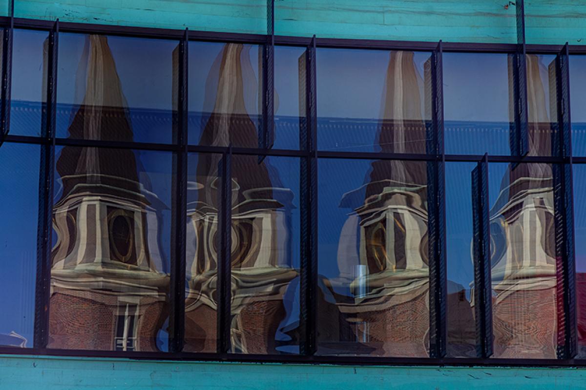 DU tower reflected in glass window
